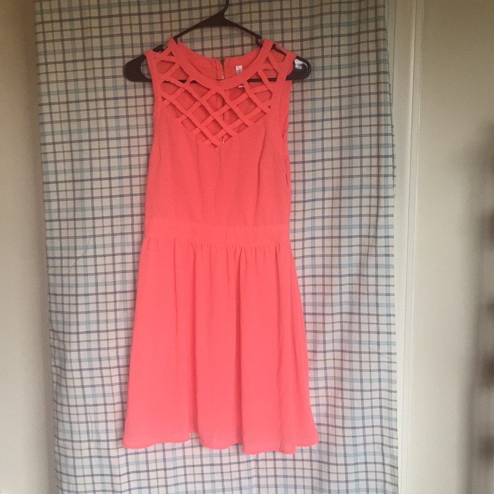 Pink summer dress, with cross detail.